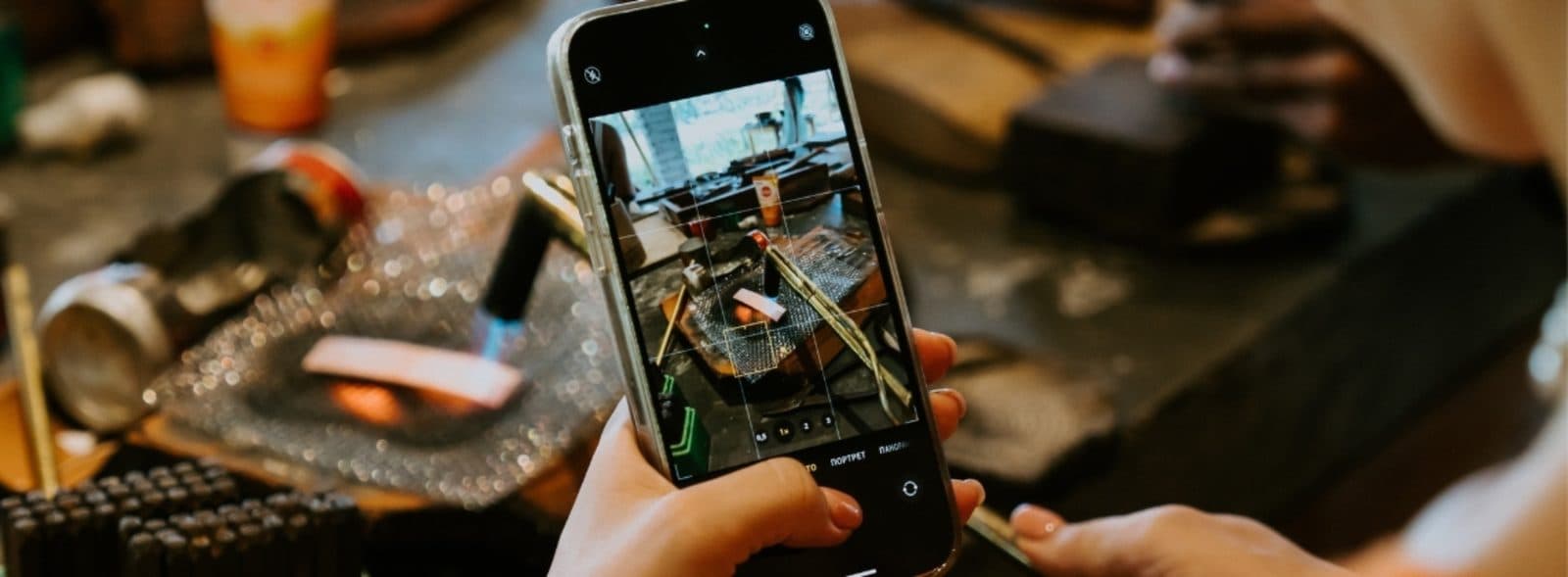 A student filming the torch as her silver heats up